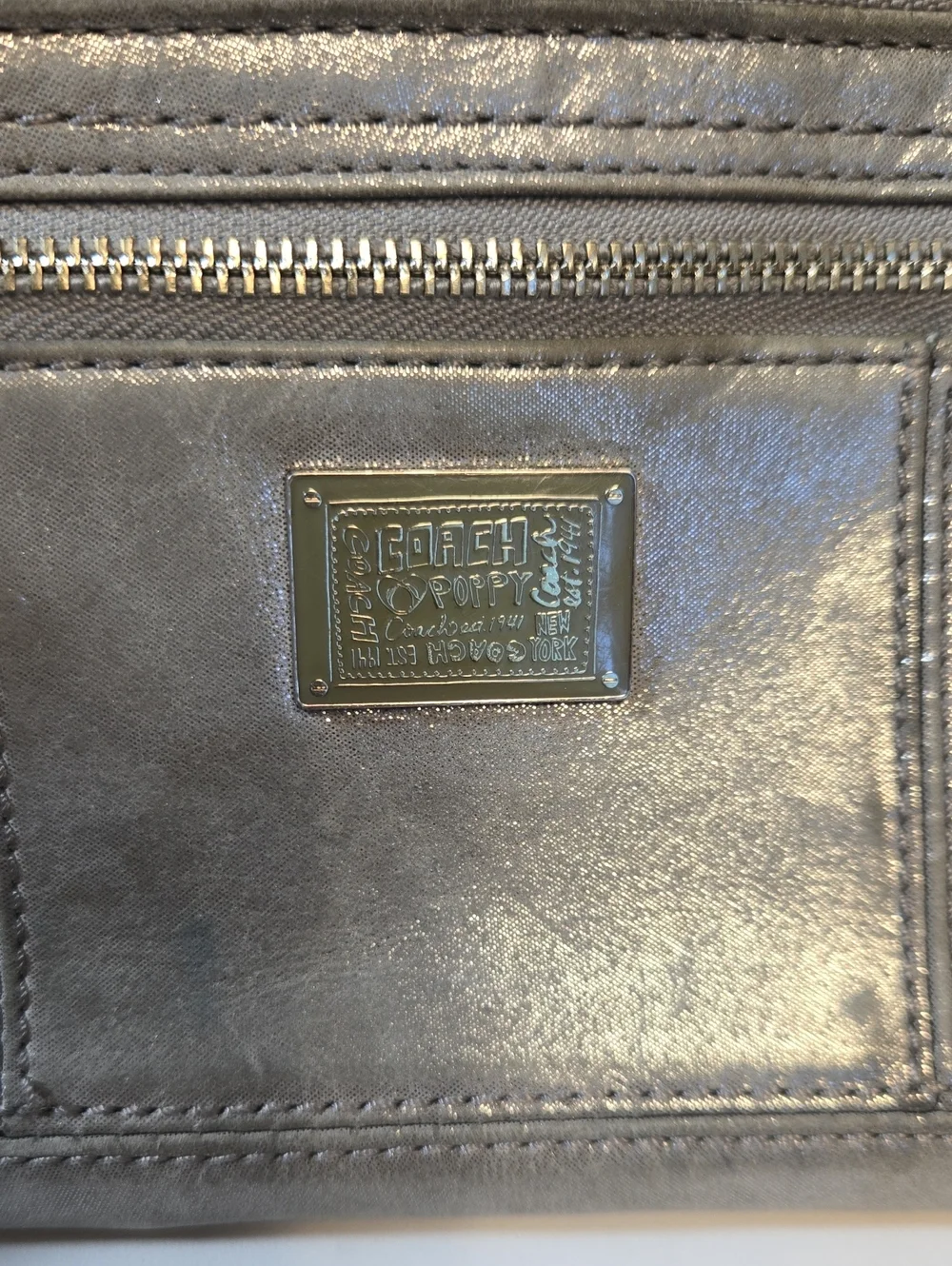 Pre-loved Coach Poppy Silver Metallic Wristlet Clutch
